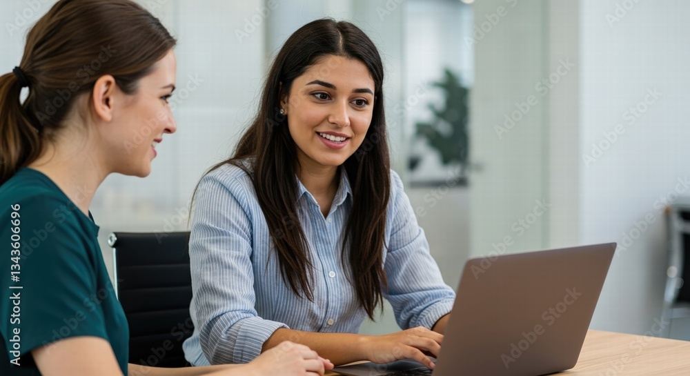 Two female office friends laughing at workplace, having fun, talking at laptop, discussing funny creative ideas, brainstorming, chatting, enjoying business friendship Two female office friends laughing at workplace, having fun, talking at laptop, discussing funny creative ideas, brainstorming, chatting, enjoying business friendship