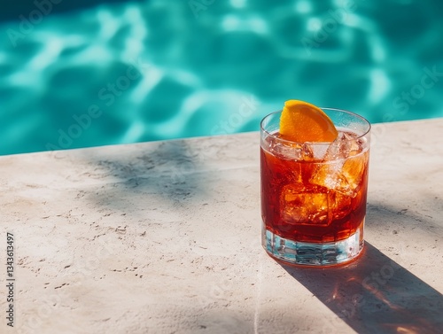 Refreshing Cocktail by the Pool: A Summer Drink with Ice and Orange Slice