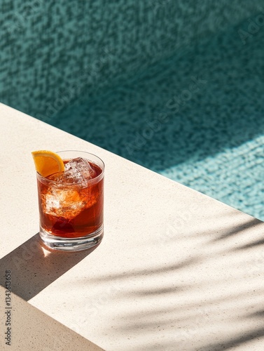 Refreshing Cocktail by the Pool: A Summer Drink with Ice and Orange Slice for a Relaxing Vacation, Alcoholic Beverage, and Tropical Vibes.