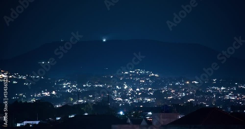 Timelapse of flickering lights of Bandung suburb on the hill at night