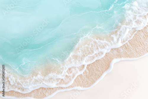 Aerial view of turquoise ocean waves gently washing onto pristine sandy beach creating calming coastal scene
