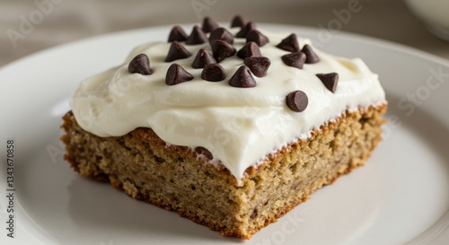 Wallpaper Mural Serving of Delicious Banana Cake with White Frosting and Chocolate Chips Torontodigital.ca