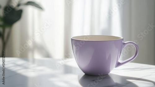 Elegant purple cup rests on marble surface illuminated by soft sunlight filtering through sheer curtains