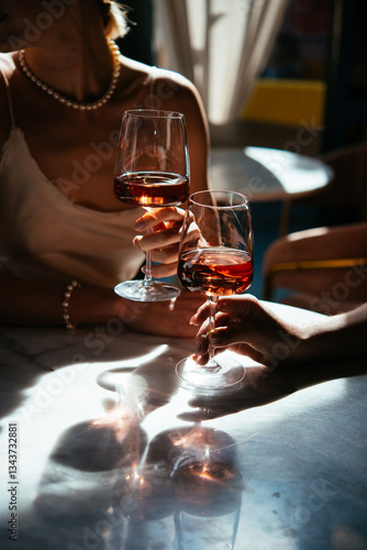 Obraz na płótnie Glasses of rose wine seen during a friendly party or a celebration in a restaurant of a bar. w salonie