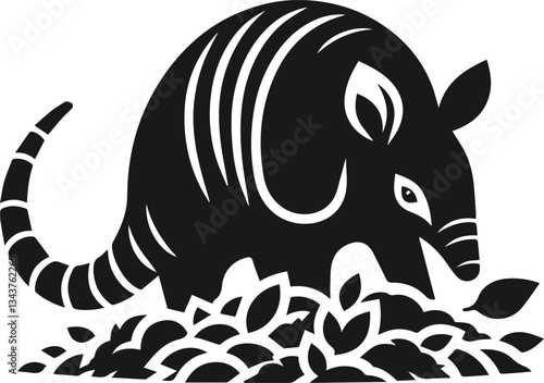 Armadillo sniffing a pile of leaves silhouette