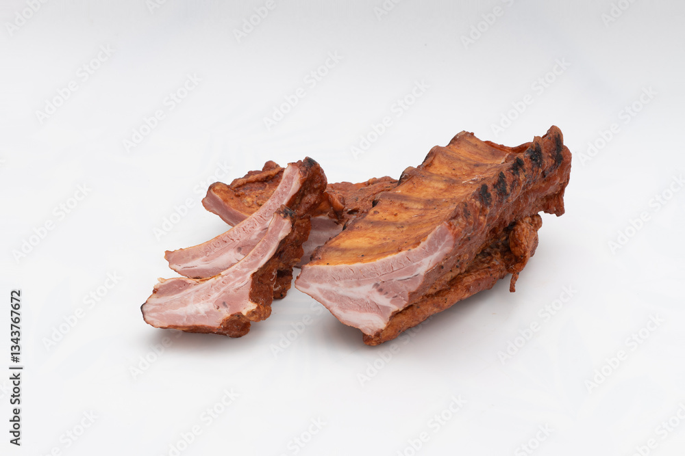 Obraz premium Delicious Smoked Pork Ribs Isolated on Clean White Background