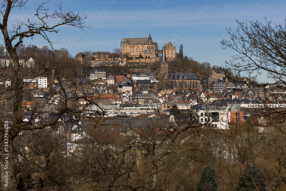 Obraz premium The Marburg Castle, also called Landgrave's Castle, and the Lutheran Parish Church (mid) above the old town of Marburg, Hesse, Germany, Europe