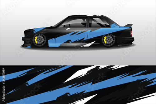 Sleek modified car with vibrant blue and black design parked on a smooth surface, showcasing details