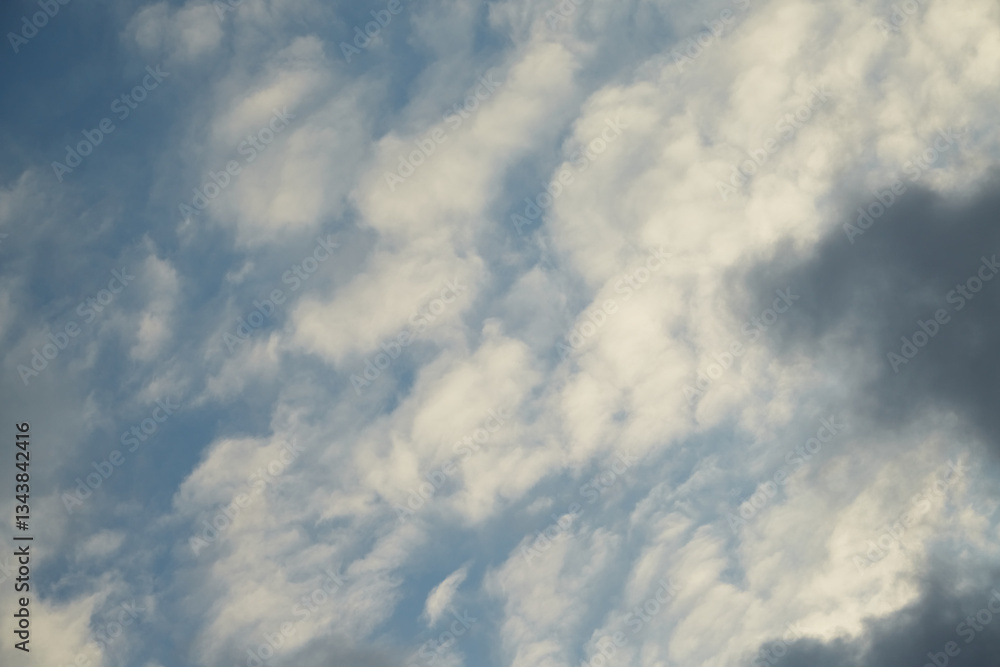 Fototapeta premium The smooth movement of clouds across the sky resembles the slow rhythm of nature's breath. Symbolizes balance and harmony with the surrounding world.