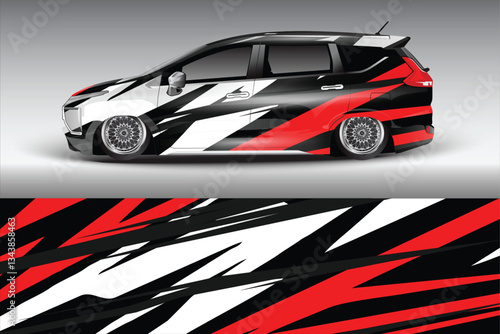 Stylish modified car with striking black and red graphics parked against a sleek gray backdrop