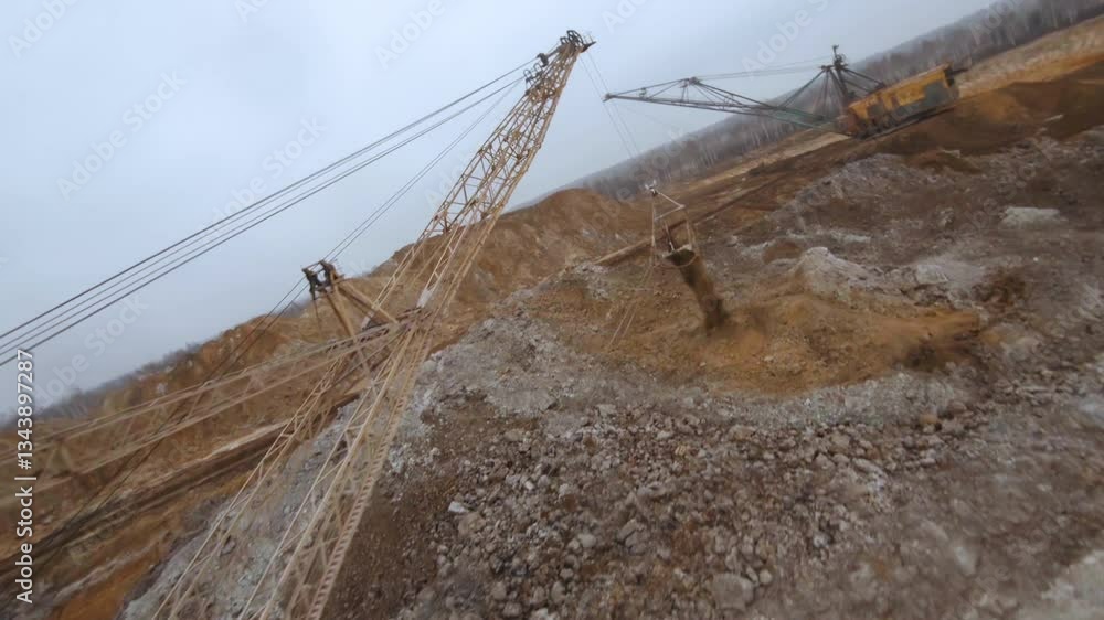 Exploring the dragline excavator at a titanium dioxide mining and processing plant captured by FPV drone Exploring the dragline excavator at a titanium dioxide mining and processing plant captured by FPV drone