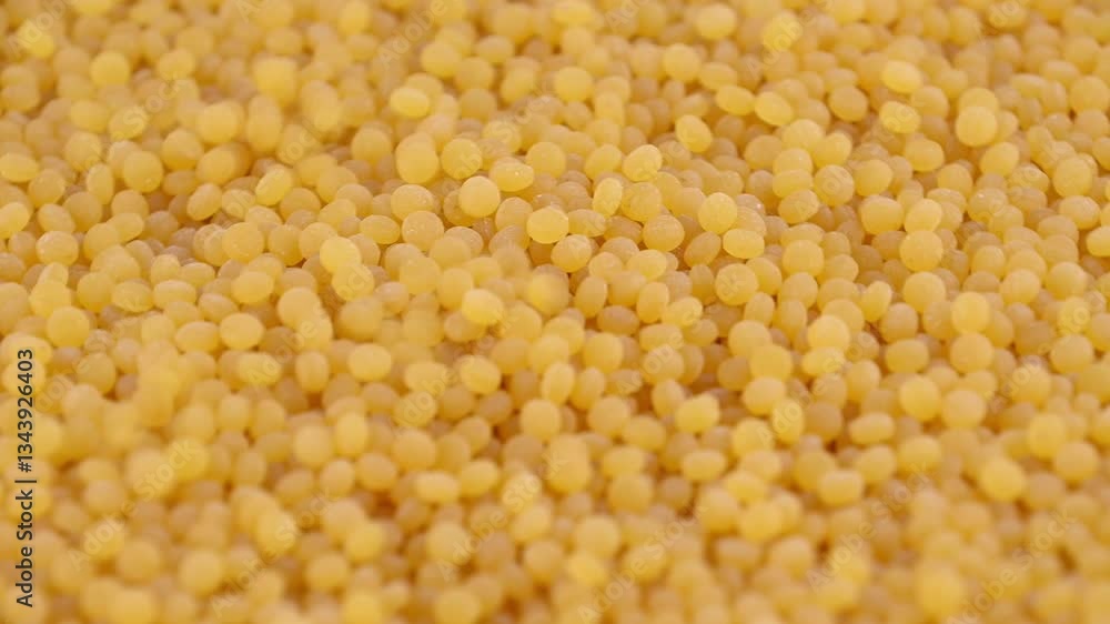 Pearl couscous. Yellow fine grain, close-up. Pearl couscous. Yellow fine grain, close-up.
