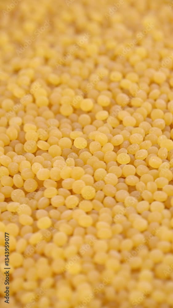 Pearl couscous. Yellow fine grain, close-up. Pearl couscous. Yellow fine grain, close-up.
