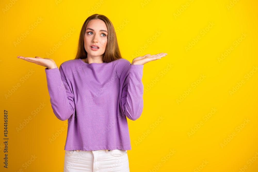 Young woman with a puzzled expression wearing casual purple shirt, posing against vibrant yellow background Young woman with a puzzled expression wearing casual purple shirt, posing against vibrant yellow background