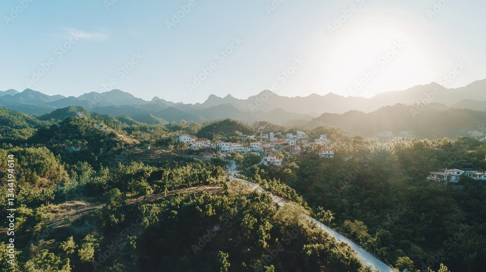 Obraz premium Sunlit mountain village scenic aerial view.
