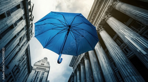A vibrant blue umbrella floats serenely between imposing classical buildings suggesting protection security and a sense of calm amidst urban chaos symbolizing resilience and hope