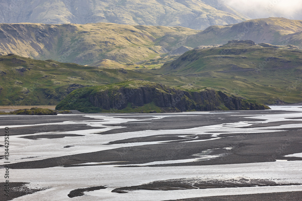 Water and sand from glaciers landscape. Lonsvik. East fjords. Iceland