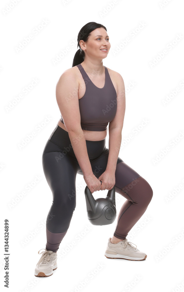 Plus size woman in gym clothes doing exercise with kettlebell on white background Plus size woman in gym clothes doing exercise with kettlebell on white background