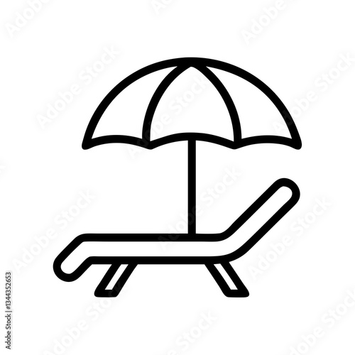 Relaxing on a beach lounge chair under a sun umbrella with waves in the distance