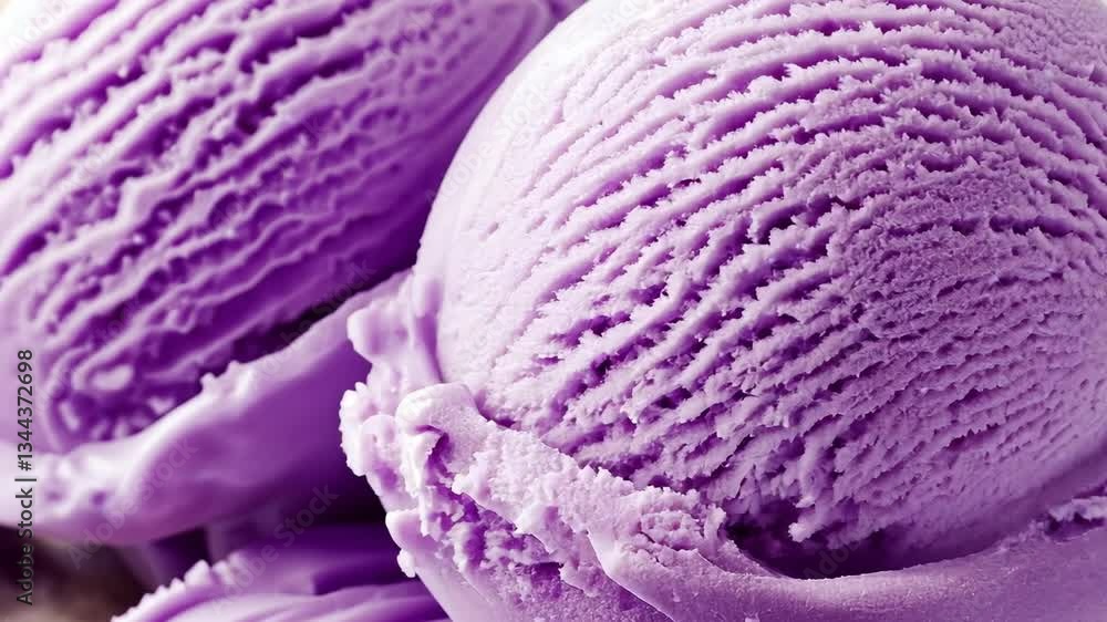 Delicious purple ice cream scoops served in a bowl, showcasing a rich texture and vibrant color during a sunny afternoon treat Delicious purple ice cream scoops served in a bowl, showcasing a rich texture and vibrant color during a sunny afternoon treat