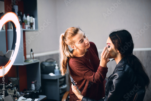 Professional Makeup Artist Creating a Bold Look