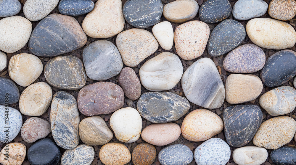 Smooth multi-colored pebble stones creating a natural and textured surface. Smooth multi-colored pebble stones creating a natural and textured surface.
