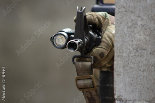 Close-Up of a Tactical Rifle with Flashlight Attachment