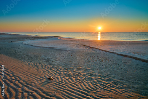 Sunrise over the Gulf of America at St. George Island Florida.