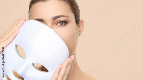 Beauty and skincare treatment featuring photon therapy light mask for skin rejuvenation with a focus on LED facial benefits