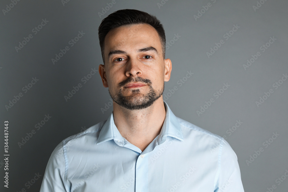 Portrait of handsome middle aged man on grey background Portrait of handsome middle aged man on grey background