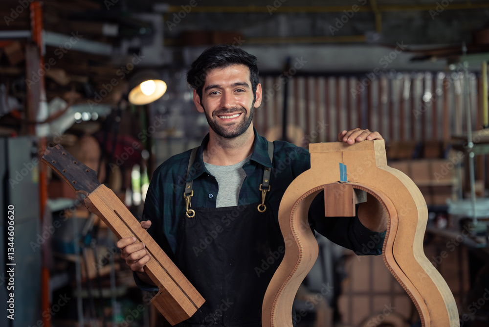 Luthier making top of guitar using traditional tools in workroom with manual tools Luthier making top of guitar using traditional tools in workroom with manual tools