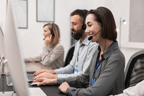 Technical support call center. Team of operators working in office