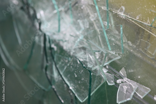Quadro su tela A pile of shattered glass sits atop a wall, with fragments scattered around