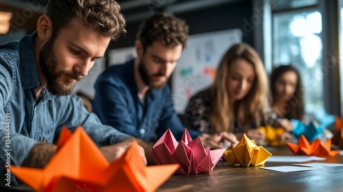 Creative team constructing paper ornaments during a collaborative workshop