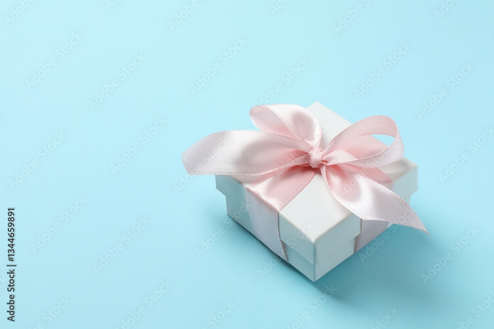 Beautiful gift box on color background Beautiful gift box on color background