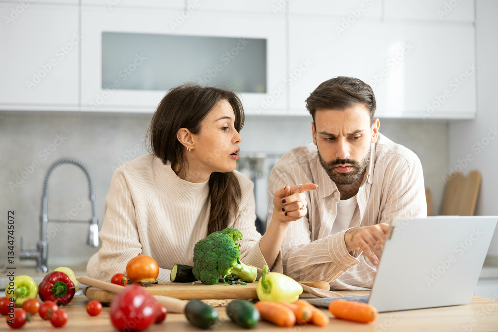 In a contemporary kitchen, a couple shares ideas about healthy cooking while surrounded by fresh produce like broccoli and tomatoes. In a contemporary kitchen, a couple shares ideas about healthy cooking while surrounded by fresh produce like broccoli and tomatoes.