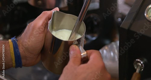 creamer being poured into cup