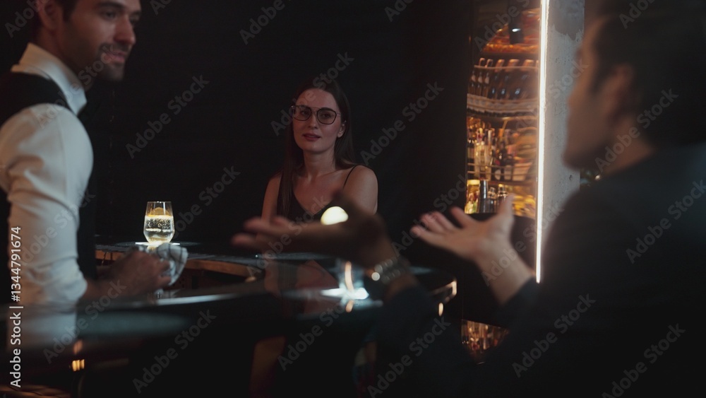 Focusing on beautiful woman guest sitting in special drink gin fizz at luxurious counter bar at vibrant nightlife party atmosphere. Smart bartender wiping glass while talking with customer. Vinosity. Focusing on beautiful woman guest sitting in special drink gin fizz at luxurious counter bar at vibrant nightlife party atmosphere. Smart bartender wiping glass while talking with customer. Vinosity.