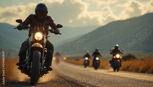 Sturgis bikers ride on countryside road. Motorcyclists navigate challenging terrain. Adventure, skill, excitement. Group rides in mountains. Freedom, lifestyle, travel. Test of endurance on rough