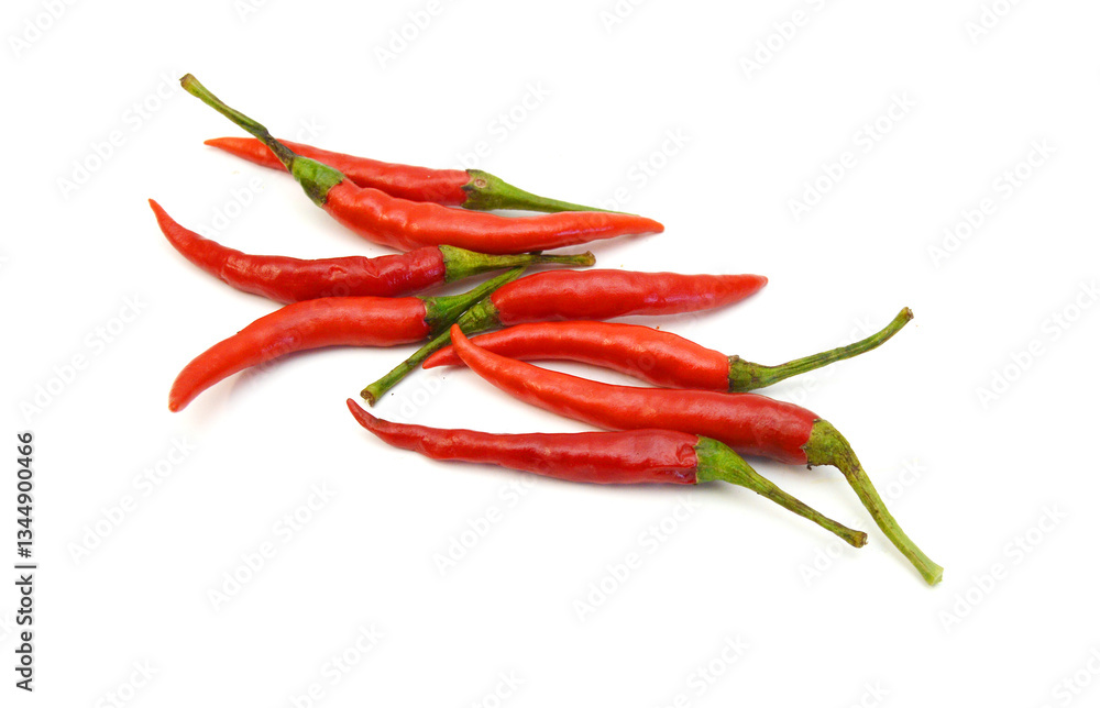 Stack red chili peppers and basil herb leaves on the white Stack red chili peppers and basil herb leaves on the white