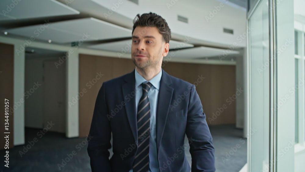 Confident businessman walking office in elegant suit closeup. Friendly male Confident businessman walking office in elegant suit closeup. Friendly male