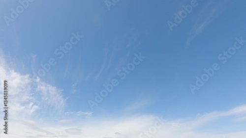 beautiful fluffy white cumulus clouds in blue sky summer season. dramatic cloud covered bright sun star in clear good atmosphere, cloudscape time-lapse of powerful sunlight beam, rays in midday,
