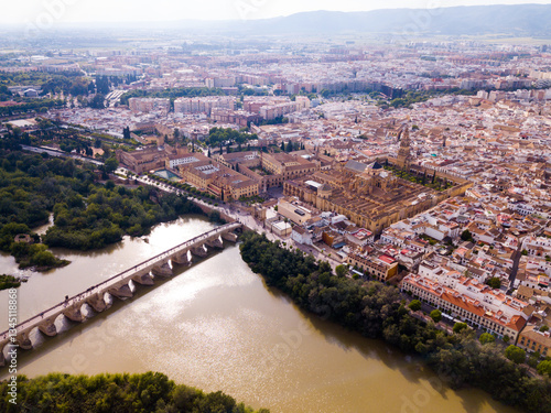 Aerial view of cityscape of Cordoba with Roman Bridge over the Guadalquivir and the Mosque-Cathedral of Cordoba