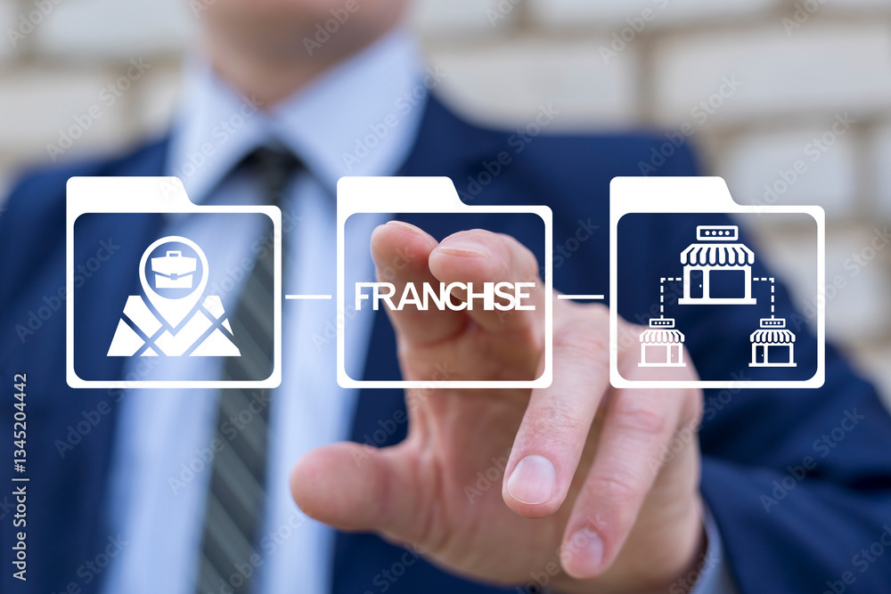 Business expansion strategy, market selection and franchise growth concept. Business person using virtual touch screen push word: FRANCHISE. Franchising modern online technology.