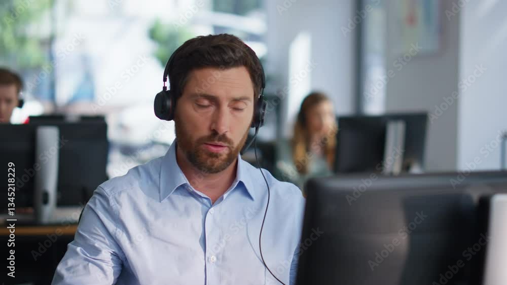 Help desk consultant solving client problem talking in headset at office closeup Help desk consultant solving client problem talking in headset at office closeup