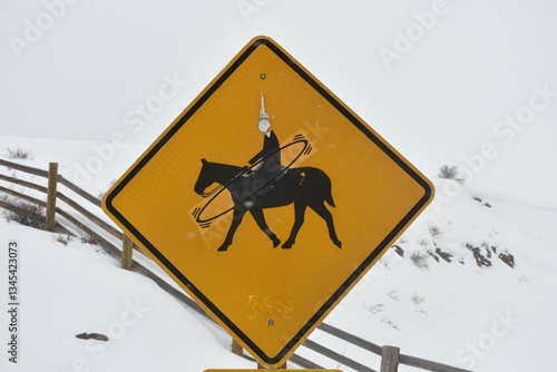 Foto Horse crossing sign with multiple defacements