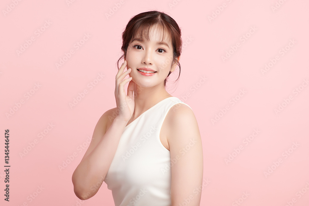 A beautiful young Asian woman with clean, fresh skin against a pink background. Skincare, facial treatment, cosmetology, beauty, and spa. An elegant portrait of an Asian woman. A beautiful young Asian woman with clean, fresh skin against a pink background. Skincare, facial treatment, cosmetology, beauty, and spa. An elegant portrait of an Asian woman.