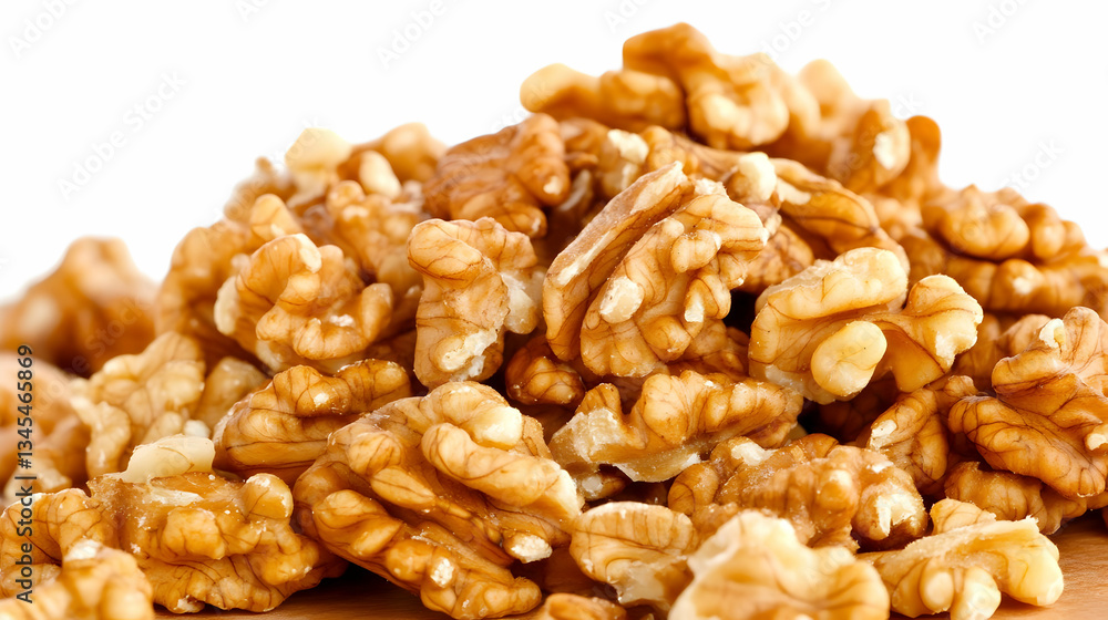 A mountain of wholesome walnuts, rich and golden brown, ready for snacking or baking, against a bright white background. A mountain of wholesome walnuts, rich and golden brown, ready for snacking or baking, against a bright white background.