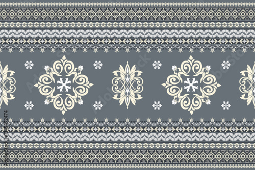 Seamless white and yellow floral damask shape with geometric ethnic tradition pattern texture on gray and black background