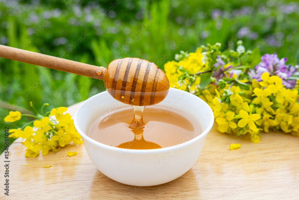 A bowl of fresh flower honey in spring A bowl of fresh flower honey in spring